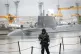 A soldier walking on the deck of a Trident nuclear submarine