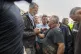 Spain's King Felipe VI speaks with people amid angry Spanish