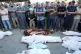 INEXCUSABLE: Al-Jazeera correspondent Wael Dahdouh, center, 