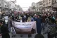 Protesters march with a banner reading ‘Without water, wit
