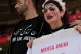 An Iranian holds up the name of the young woman who died at