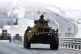 A convoy of Russian armored vehicles moves along a highway i