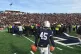 Yale punter Jack Bosman watches as demonstrators stage a pro