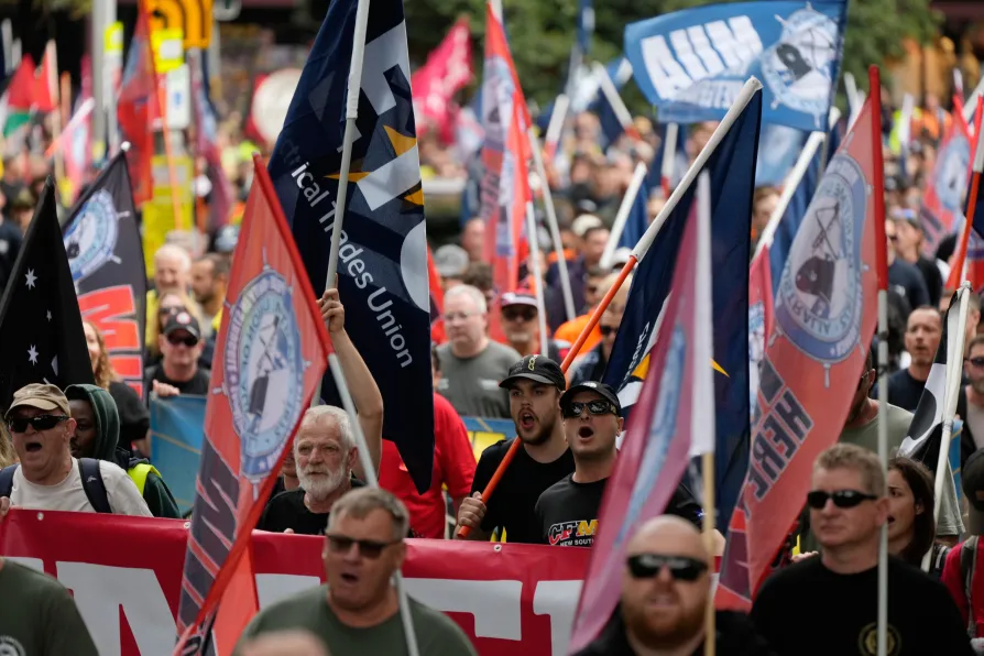 People march to mark International Workers' Day, also known as May Day, in Sydney, Friday, May 1, 2026