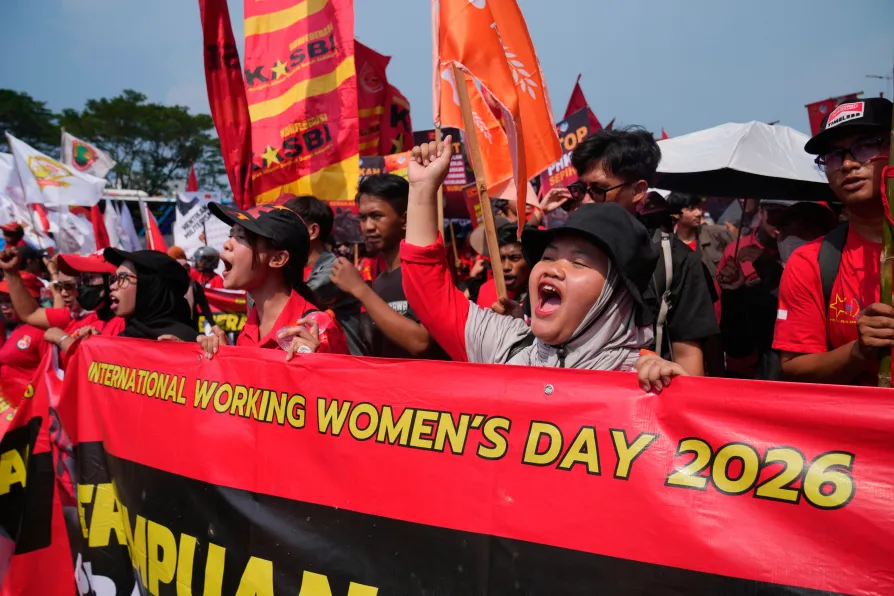 Protesters shout slogans during a May Day rally in Jakarta, Friday, May 1, 2026